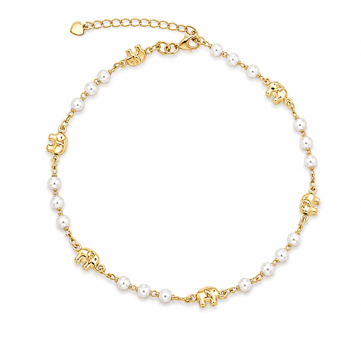 A gold-plated elephant and faux pearl anklet gleams against a white background.