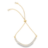 A delicate gold bolo bracelet features a curved arch of sparkling baguette-cut diamonds along the bottom.