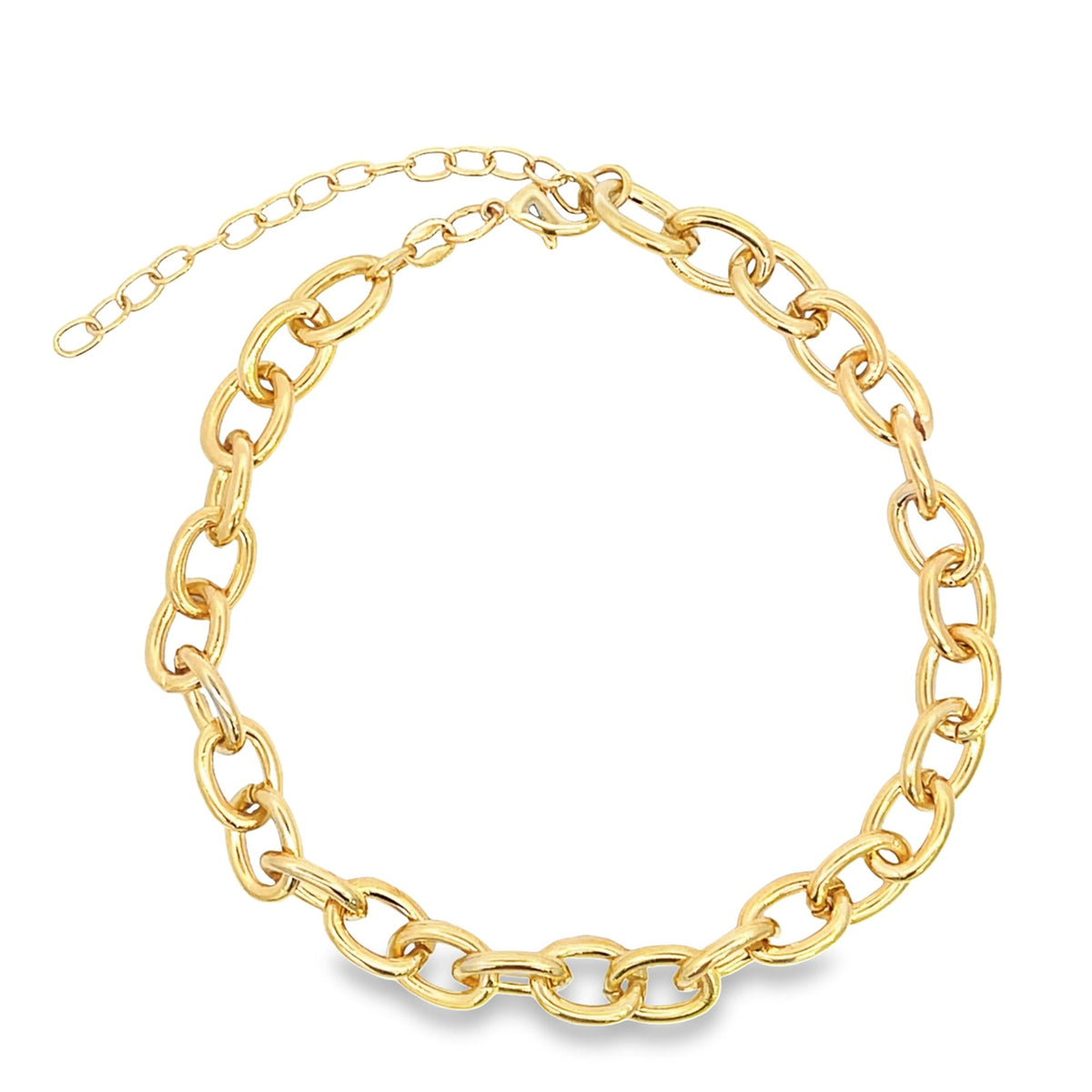 A thick gold chunky chain necklace lies in a circle on a white background.
