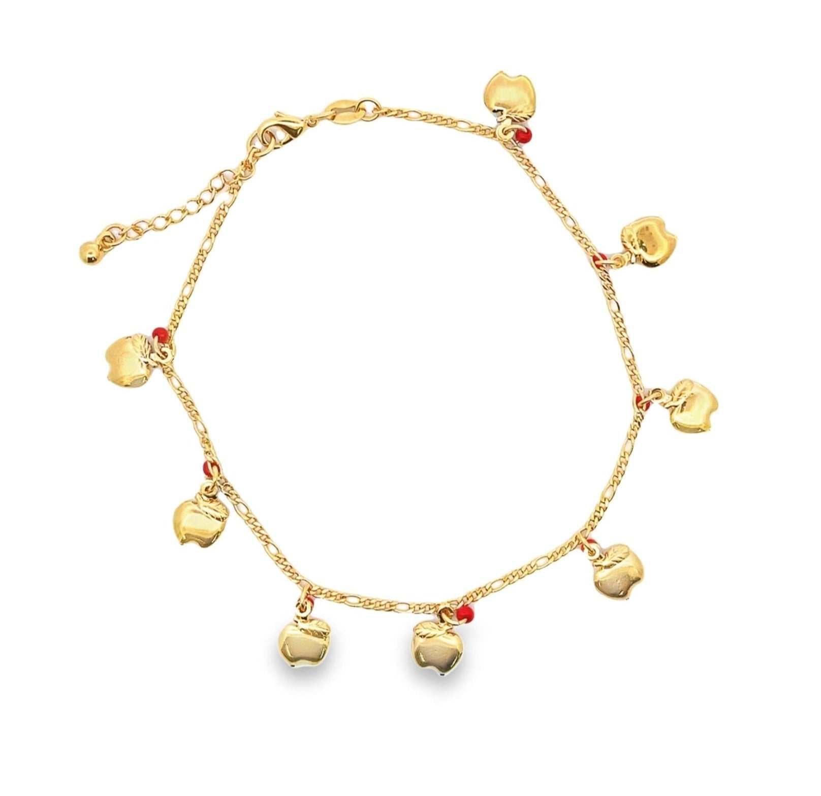 A gold charm anklet features dangling apple pendants interspersed with small red beads against a plain white background.