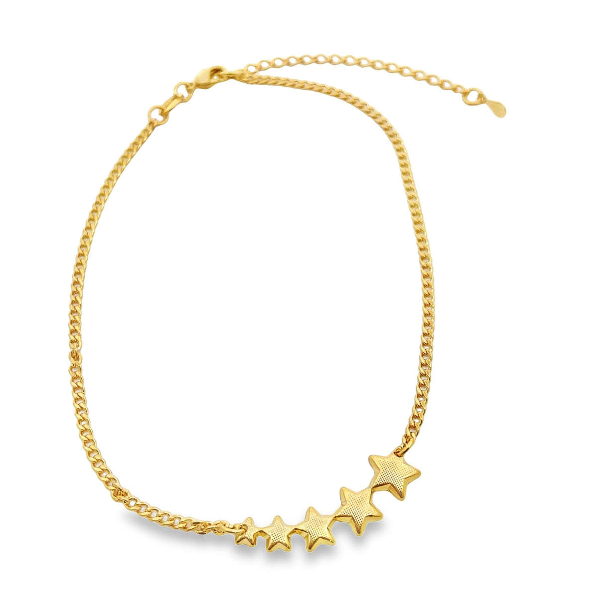 A delicate gold chain necklace sparkles against a white background, featuring a charming cluster of textured star charms in a gradient of sizes along the lower curve.