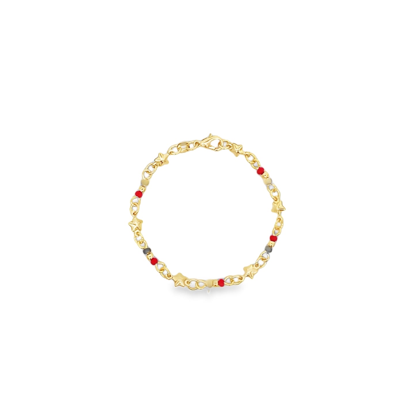 A delicate gold charm bracelet features whimsical star-shaped accents and colorful red beads against a clean white background.