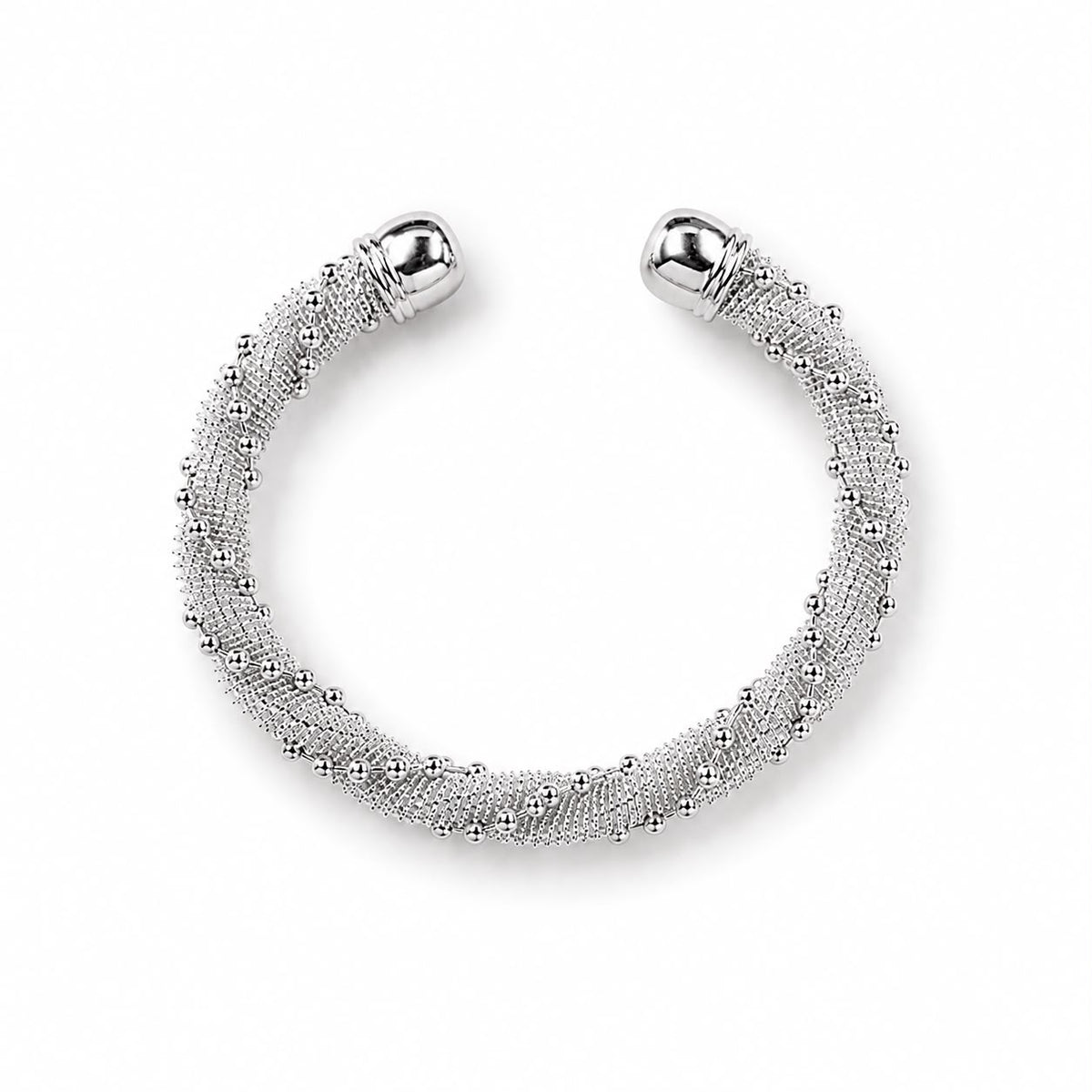 A silver open cuff bracelet features an intricate textured mesh design accented with polished ball ends.