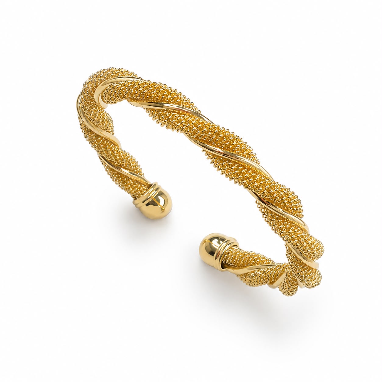 Elegant 18K Gold Filled twisted mesh cuff bracelet featuring a woven textured design with polished twisted accents. Lightweight, adjustable and perfect for everyday wear.
