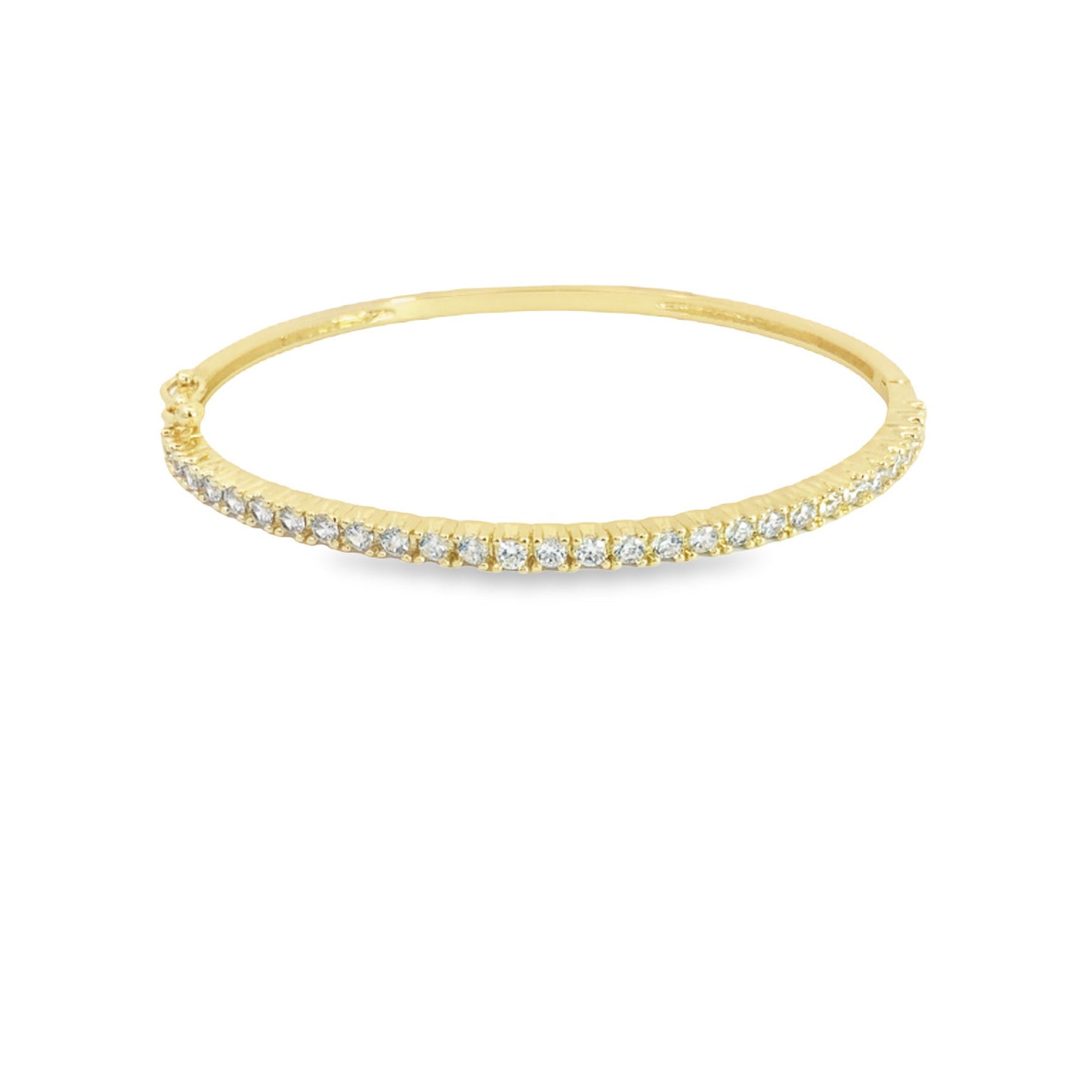 A delicate gold bangle bracelet sparkles with a continuous row of pave-set diamonds against a clean white background.