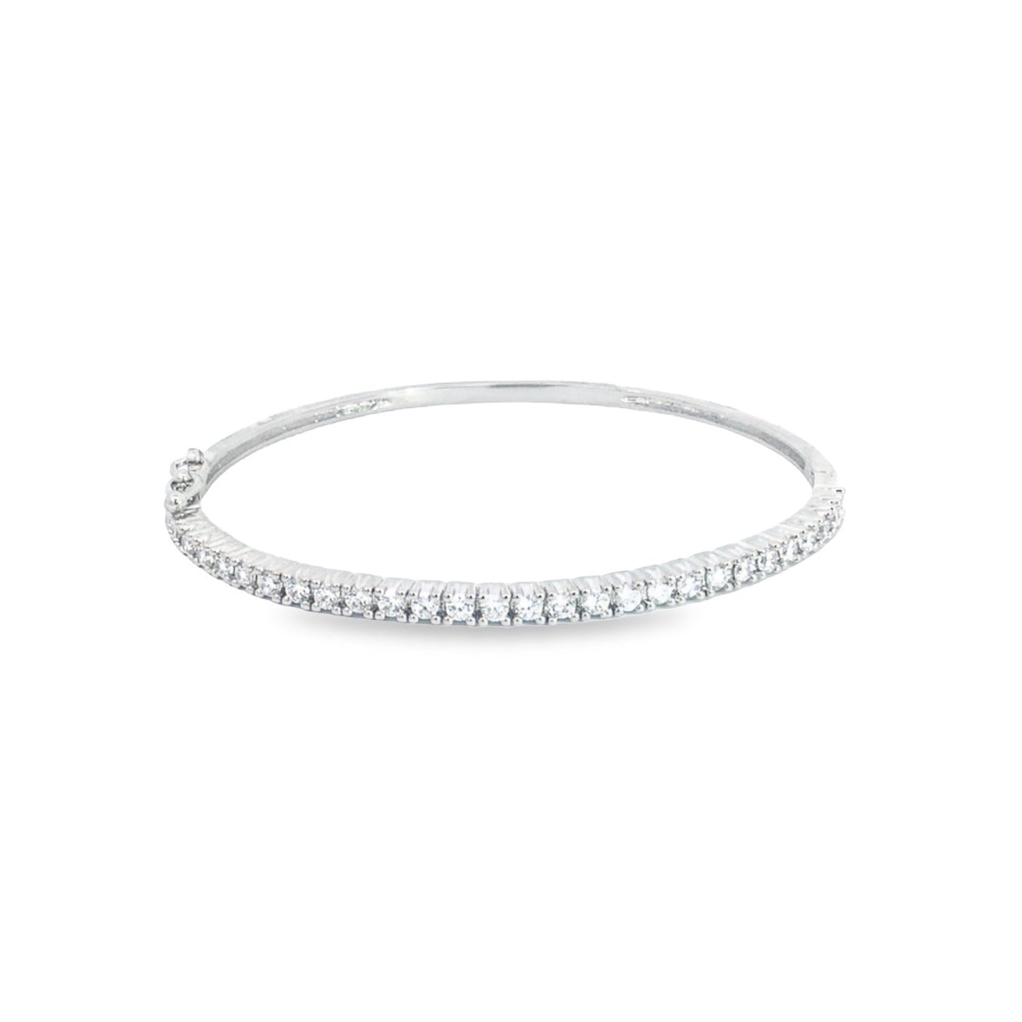 A sparkling diamond tennis bracelet rests on a clean white background.