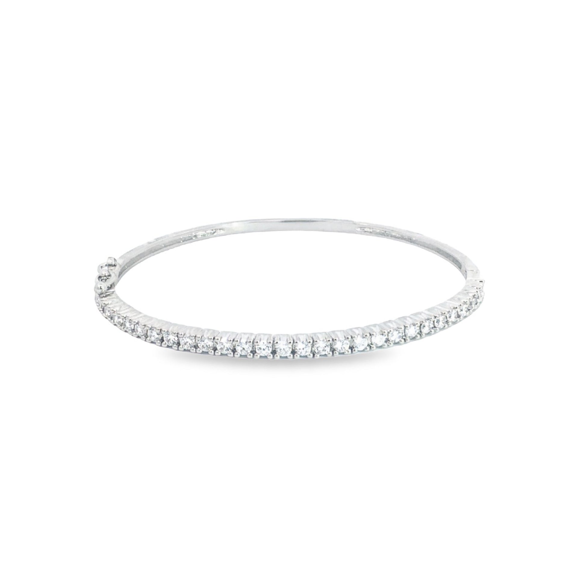 A sparkling diamond tennis bracelet rests on a clean white background.