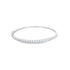 A sparkling diamond tennis bracelet rests on a clean white background.