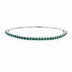 Elegant slim tennis bangle bracelet with sparkling colored CZ stones. Stackable minimalist design available in multiple color options for everyday luxury styling.
