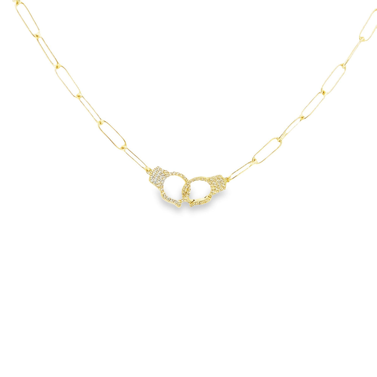 A delicate gold paperclip chain necklace features a sparkling diamond-encrusted handcuff pendant at the center.