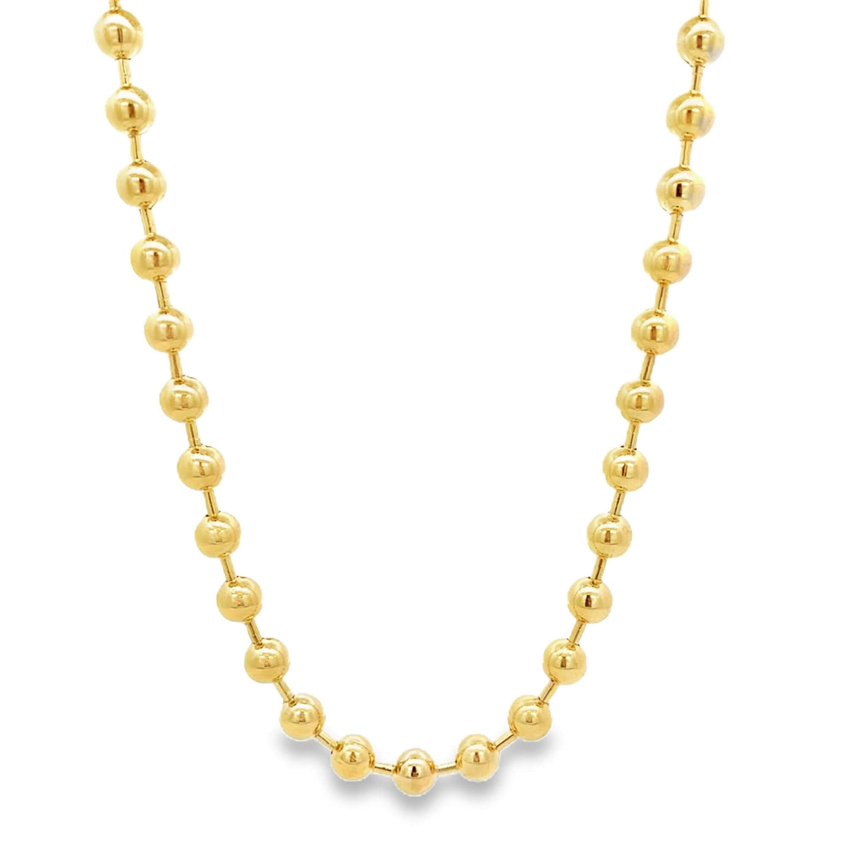 A shiny gold ball chain necklace drapes against a clean white background, showcasing its polished bead links.