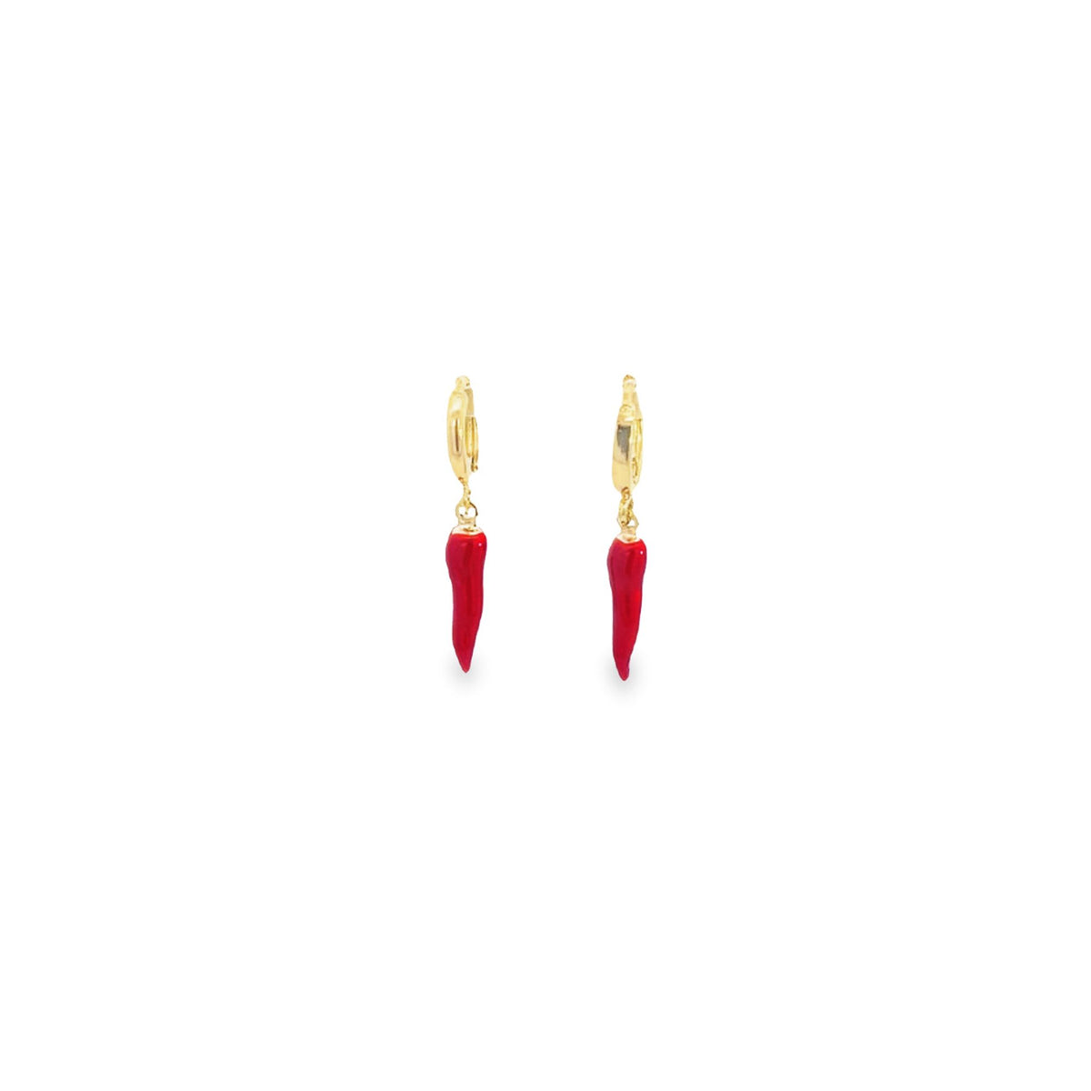 A pair of gold hoop earrings featuring dangling red chili pepper charms rests against a plain white background.