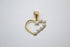 A delicate two-tone gold heart pendant features a smooth yellow gold outline accented with a cascade of textured white gold miniature hearts.