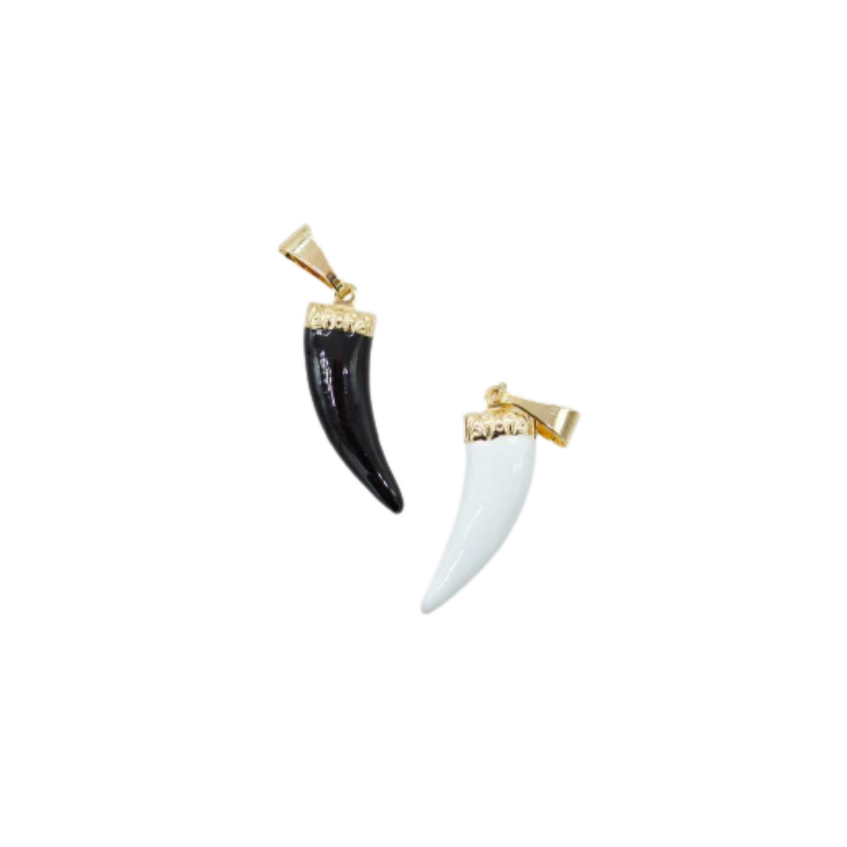 Two contrasting horn-shaped pendants in black and white enamel with gold bails are displayed on a white background.