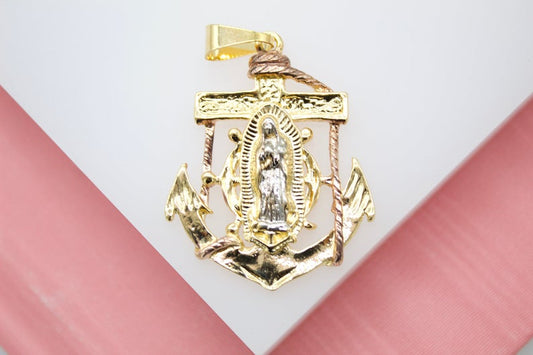 A detailed two-tone gold pendant features Our Lady of Guadalupe set against a maritime anchor and ship's wheel.