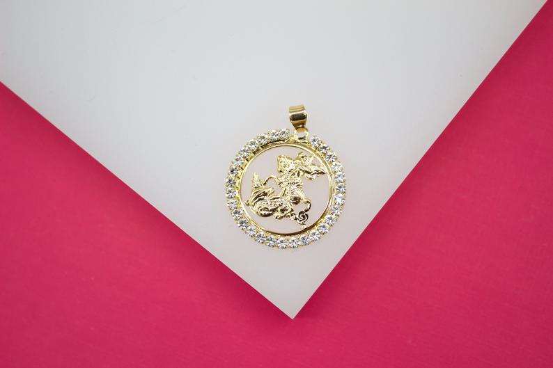 A gold Capricorn zodiac pendant sparkles with CZ crystals set in a circular frame against a white and pink background.