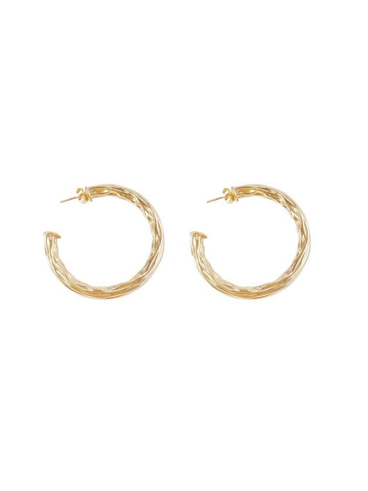 A pair of textured gold hoop earrings displays a twisted, organic design against a clean white background.