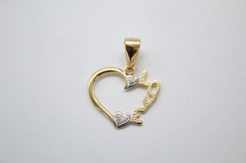 A two-tone gold heart pendant features the word "Love" and two smaller hearts integrated into the design.