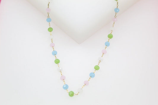 A delicate gold chain necklace features a colorful assortment of pastel pink, blue, green, and white beaded accents.