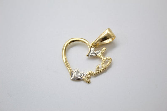 A two-tone gold heart pendant features delicate silver heart accents and intricate filigree details against a plain background.