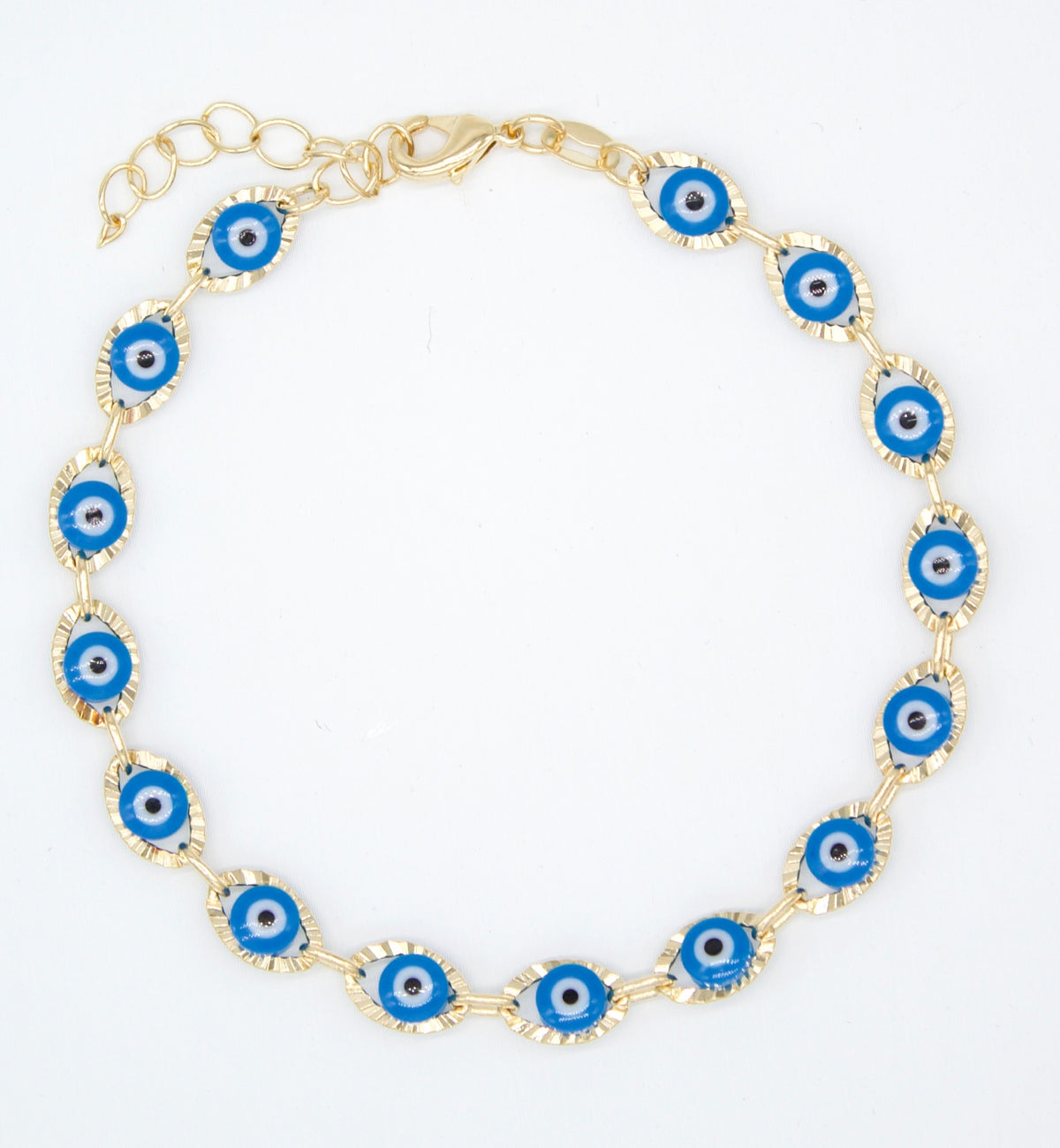 A gold link bracelet features alternating blue and white evil eye charms arranged in a circle against a plain white background.