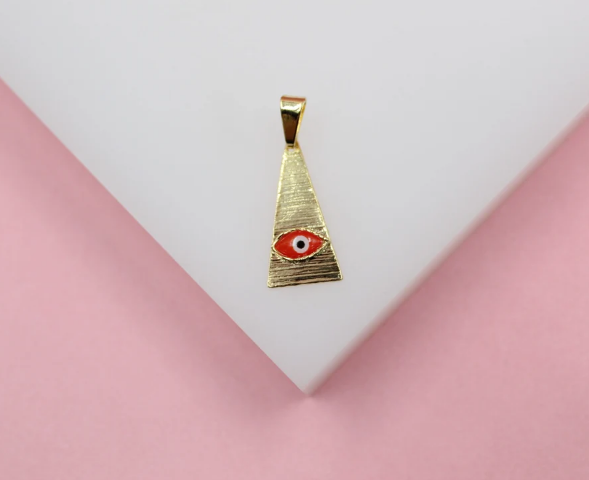 A gold triangular pendant with a textured finish features a red and white evil eye symbol centered near the bottom against a white and pink background.