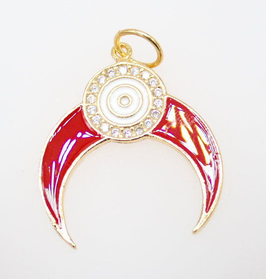 A gold-plated charm features a vibrant red enamel crescent shape accented by a sparkling rhinestone halo and a central white evil eye symbol.