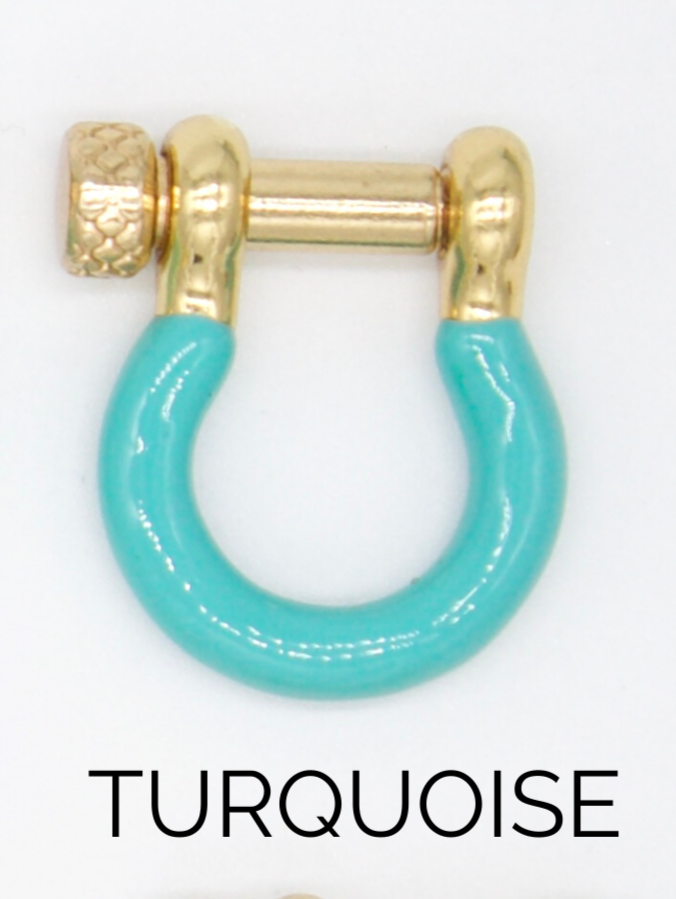 A gold shackle-shaped earring featuring a vibrant turquoise enamel coating sits against a white background.