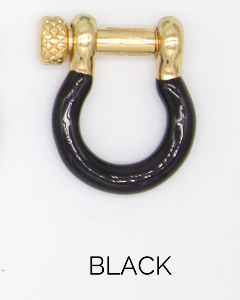 A U-shaped gold shackle featuring a glossy black enamel coating and a textured screw pin sits against a plain white background with the word black printed below it.