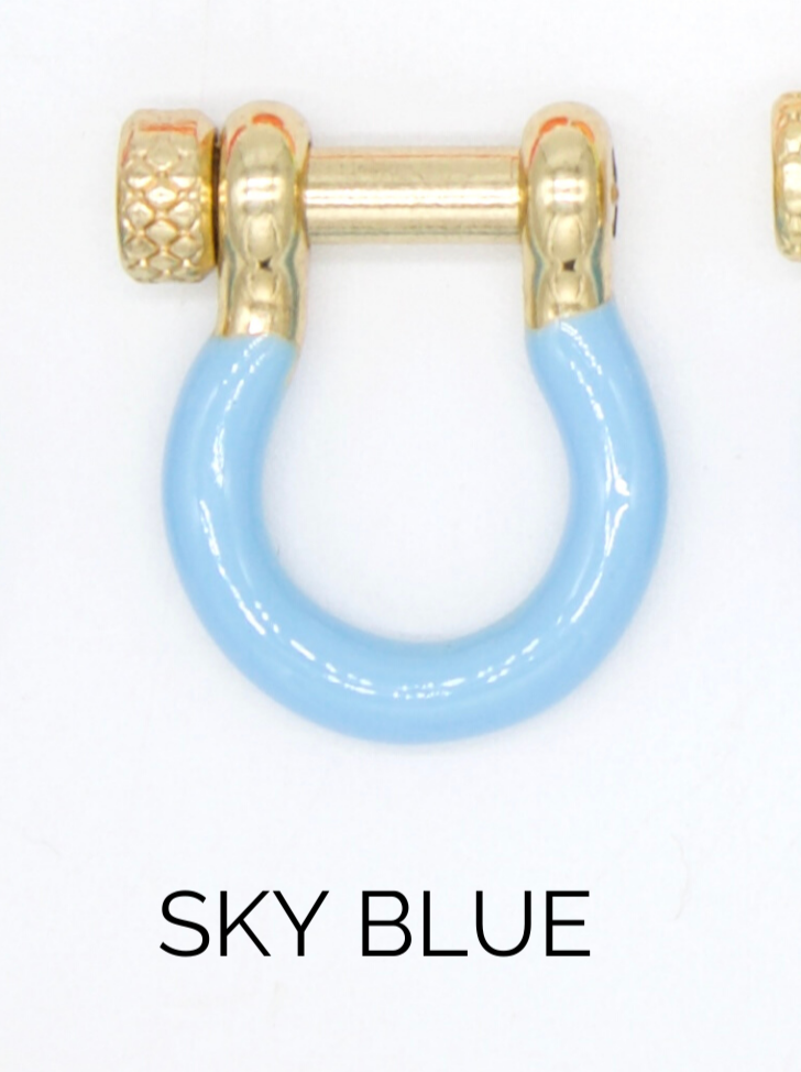 A shiny gold shackle earring features a vibrant sky blue enameled loop and a textured screw pin closure.
