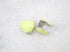 A pair of cute pastel yellow heart-shaped huggie hoop earrings rest on a white marble surface.