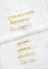 A collection of gold word charms, featuring phrases like "IT&