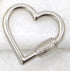 A shiny silver heart-shaped carabiner rests on a textured white surface.