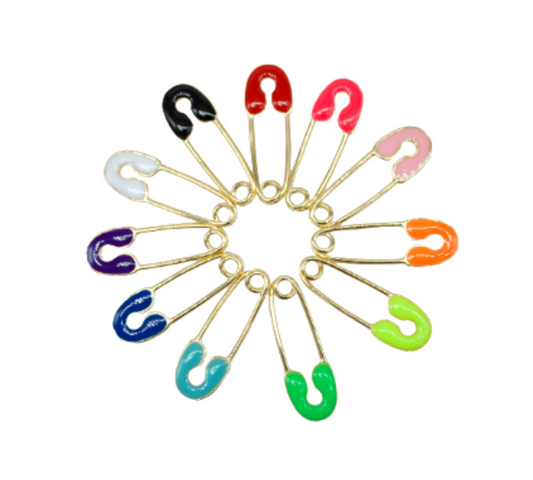 A vibrant circle of colorful enamel safety pins arranged on a clean white background.