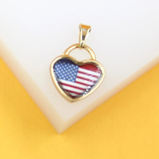 A gold heart-shaped pendant features an American flag design against a white and yellow background.