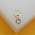 A delicate gold hoop earring features a sparkling cubic zirconia pendant centered on a white display block.