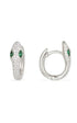 A pair of silver snake hoop earrings features pavé-set crystals and vibrant green marquise eyes against a clean white background.