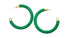 A pair of glossy green hoop earrings with gold hardware rests on a white background.