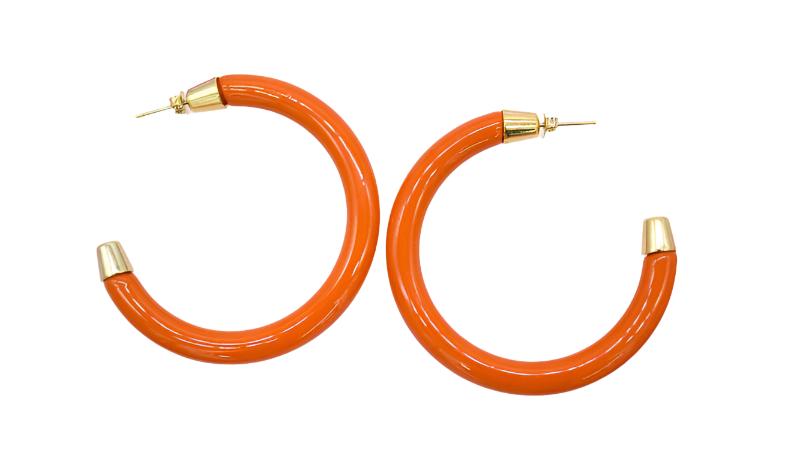 A pair of glossy orange hoop earrings with gold-plated caps rest against a plain white background.
