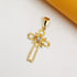 An ornate gold cross pendant features an intricate flower design with a central diamond accent resting against a clean white background.